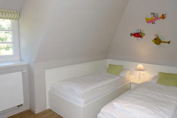 Schlafzimmer 3 im Ferienhaus Steuerbord in Süddorf auf Amrum Haus *Strandweg 8* Friesenhaushälfte *Steuerbord*