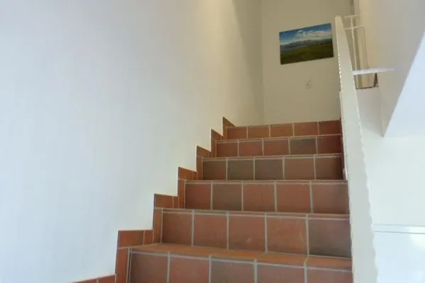 Treppenaufgang im Ferienhaus Steuerbord in Süddorf auf Amrum Haus *Strandweg 8* Friesenhaushälfte *Steuerbord*