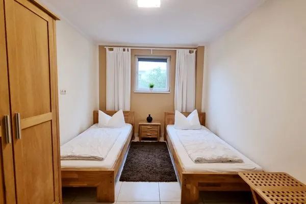 Schlafzimmer  Ferienwohnung "Baltic Sunrise" mit Garten an der Ostseeküste