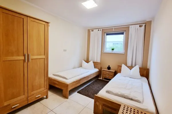 Schlafzimmer  Ferienwohnung "Baltic Sunrise" mit Garten an der Ostseeküste