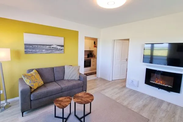 Wohnzimmer  Ferienwohnung "Baltic Sunset" in 1. Reihe zum Ostseestrand
