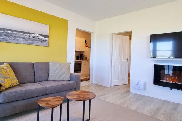 Wohnzimmer  Ferienwohnung "Baltic Sunset" in 1. Reihe zum Ostseestrand