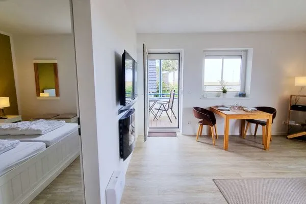 Wohnzimmer  Ferienwohnung "Baltic Sunset" in 1. Reihe zum Ostseestrand