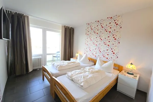 Schlafzimmer  Ferienwohnung "Deichwind" in Holm an der Ostsee