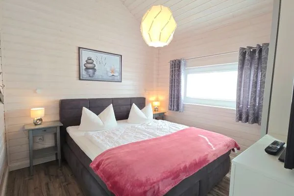 Schlafzimmer  Ferienhaus "Lönneberga" im Ferienpark Holm an der Ostsee