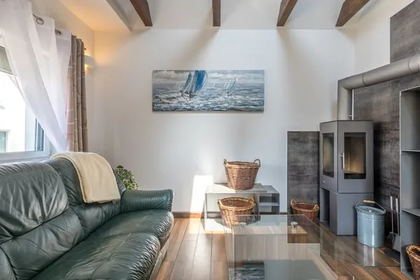 Ferienwohnung Seeperle Wohnzimmer mit Ofen  Seeperle