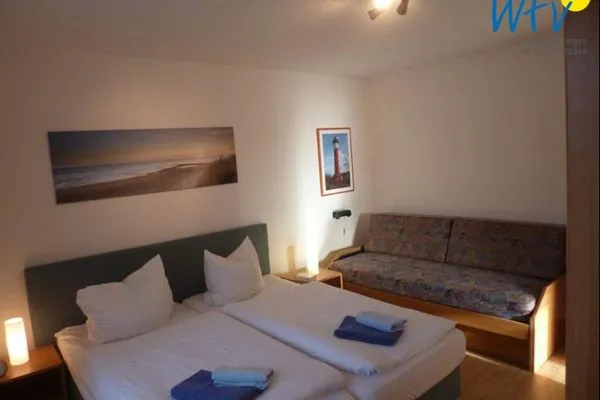 Schlafzimmer Haus Dünenrose Ferienwohnung Seestern