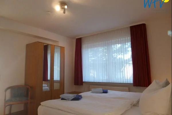 Schlafzimmer Haus Dünenrose Ferienwohnung Seestern