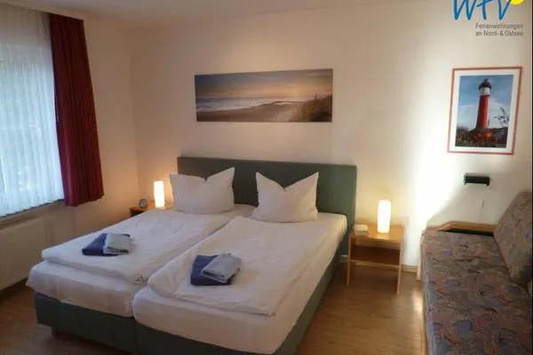 Schlafzimmer Haus Dünenrose Ferienwohnung Seestern