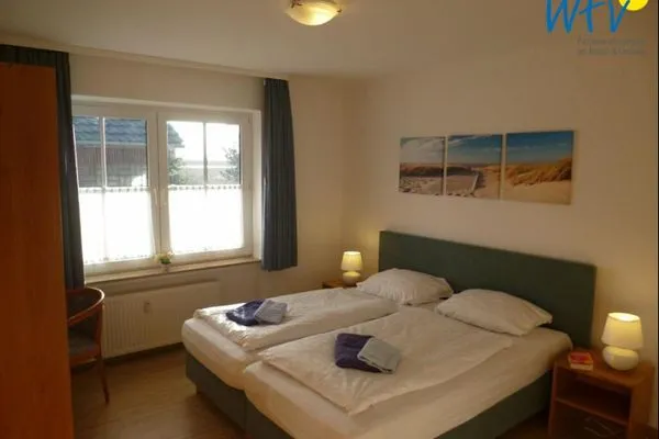 Schlafzimmer Haus Dünenrose Ferienwohnung Seestern