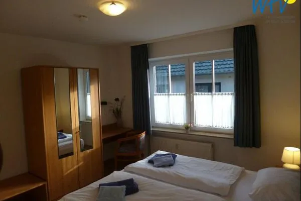Schlafzimmer Haus Dünenrose Ferienwohnung Seestern
