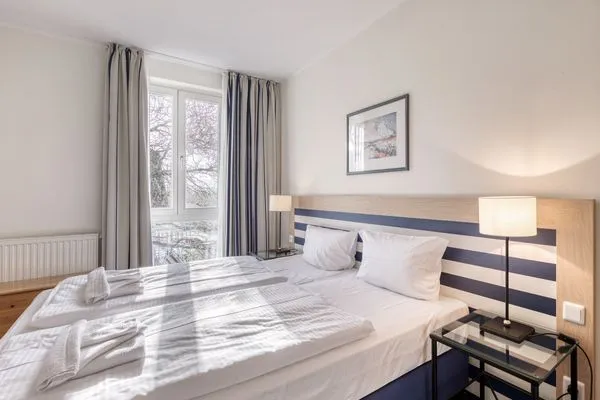 Ferienwohnung Krosse Krabbe gemütliches Doppelbett im Schlafzimmer  Krosse Krabbe