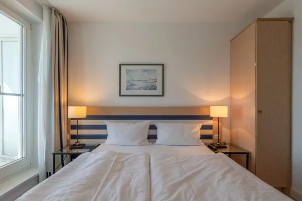 Ferienwohnung Sturmmöwe gemütliches Doppelbett im Schlafzimmer  Sturmmöwe