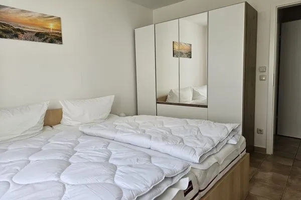 Schlafzimmer mit Doppelbett Residenz am Strand Wohnung 4-56