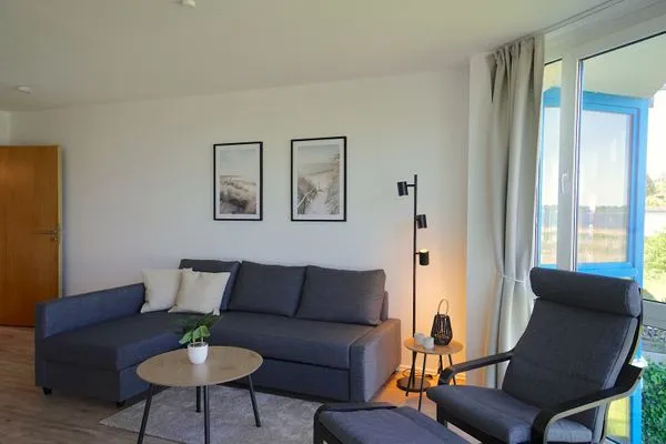 Wohnzimmer  Moderne Ferienwohnung N°9 Stexwig mit Panorama Schleiblick