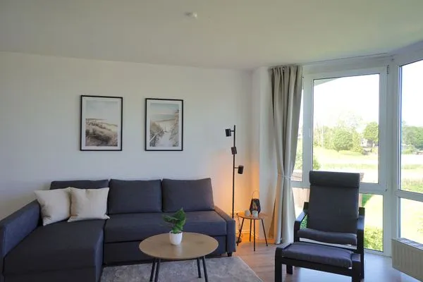 Wohnzimmer  Moderne Ferienwohnung N°9 Stexwig mit Panorama Schleiblick