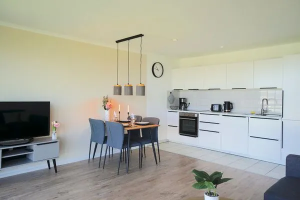 Wohnzimmer  Moderne Ferienwohnung N°9 Stexwig mit Panorama Schleiblick