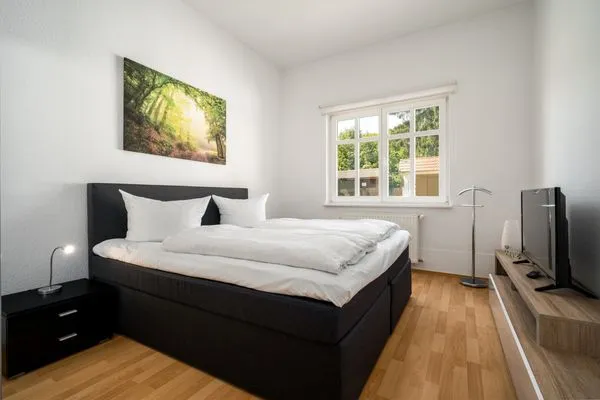 Ferienwohnung Strandgut Malchow - Doppelbett in einem der Schlafzimmer  Strandgut