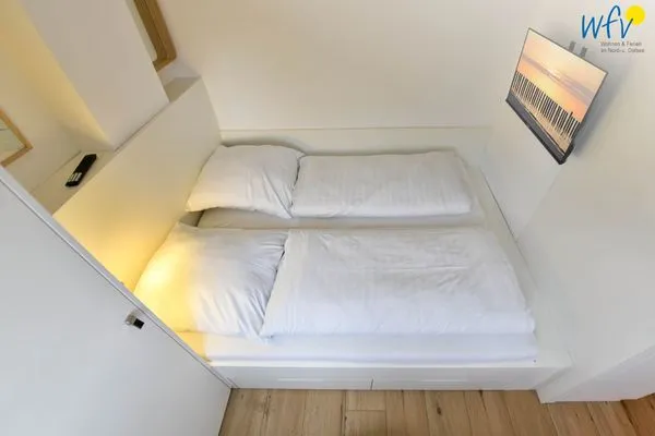 Schlafzimmer Haus am Dorfbrunnen Ferienwohnung Strandfloh