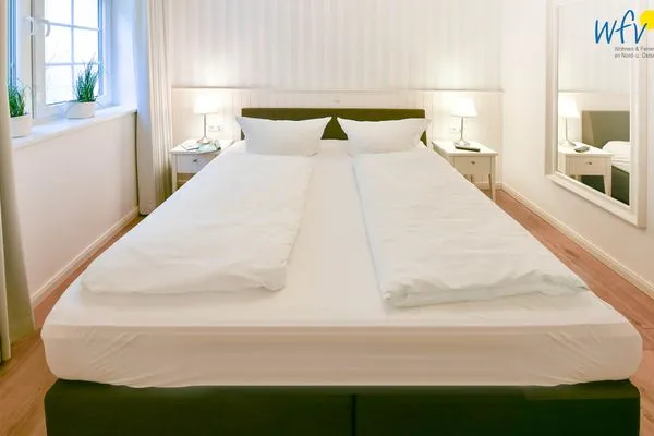 Schlafzimmer Ferienhaus "Meine Insel Juist" Ferienwohnung Düne