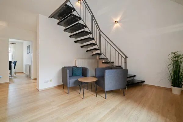 Ferienhaus Landhus Alt Schwerin Wohnzimmer mit Wendeltreppe  Landhus