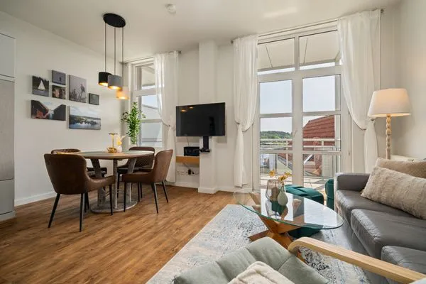 Ferienwohnung Hafenkino Waren (Müritz) - Wohnzimmer mit TV  Hafenkino