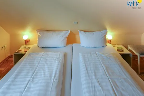 Schlafzimmer Haus Dünenblick Ferienwohnung 20