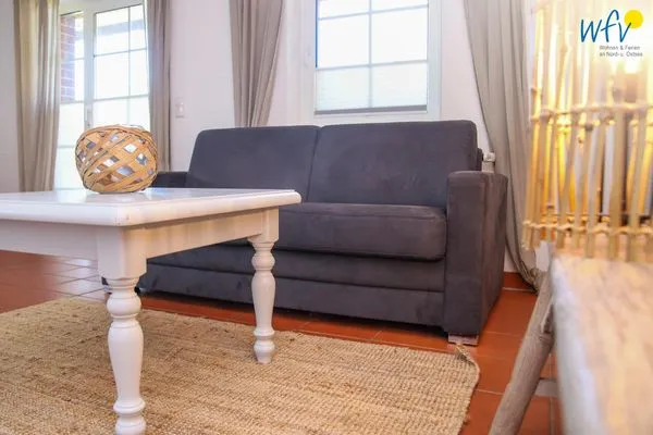 Wohnzimmer Ferienhaus am Gutspark Dranske Ferienwohnung Silbergras