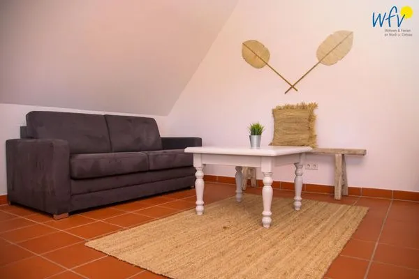 Wohnzimmer Ferienhaus am Gutspark Dranske Ferienwohnung Küstenklee
