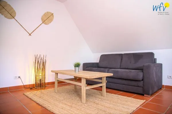 Wohnzimmer Ferienhaus am Gutspark Dranske Ferienwohnung Strandkamille