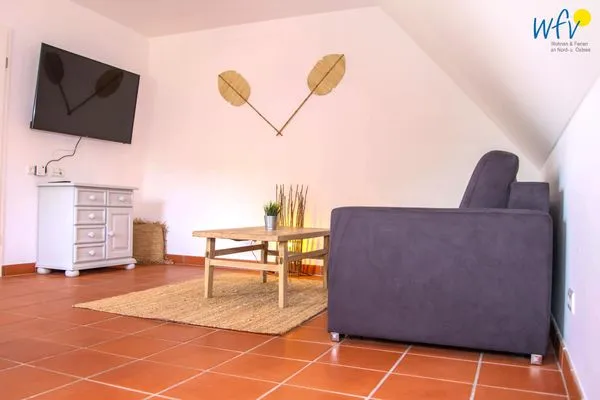 Wohnzimmer Ferienhaus am Gutspark Dranske Ferienwohnung Strandkamille