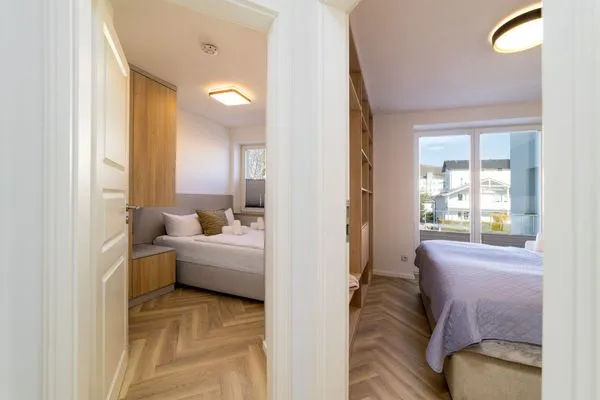 Schlafzimmer  FeWo Meerzeit - Balkon, Sauna, Meerblick
