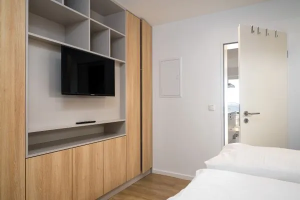 Schlafzimmer  FeWo Silbermöwe - Meerblick,Terrasse, Sauna, Fitness