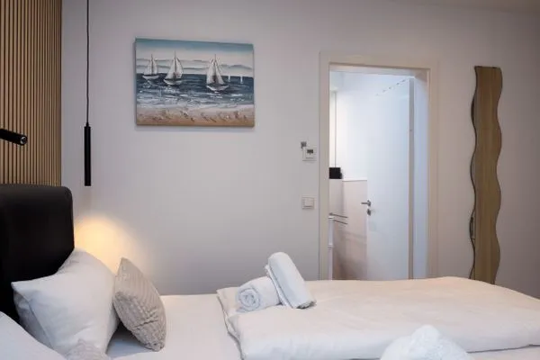 Schlafzimmer  FeWo Silbermöwe - Meerblick,Terrasse, Sauna, Fitness