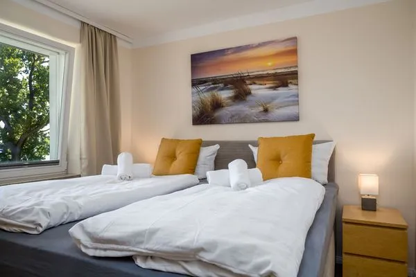 Schlafzimmer  FeWo Hafenliebe - Kamin, Sauna, Meerblick