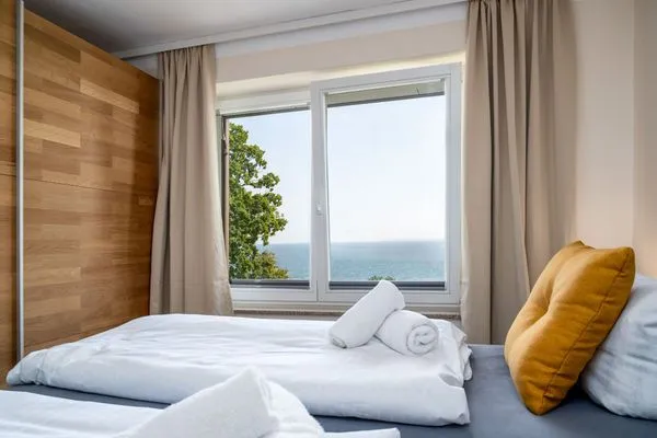 Schlafzimmer  FeWo Hafenliebe - Kamin, Sauna, Meerblick