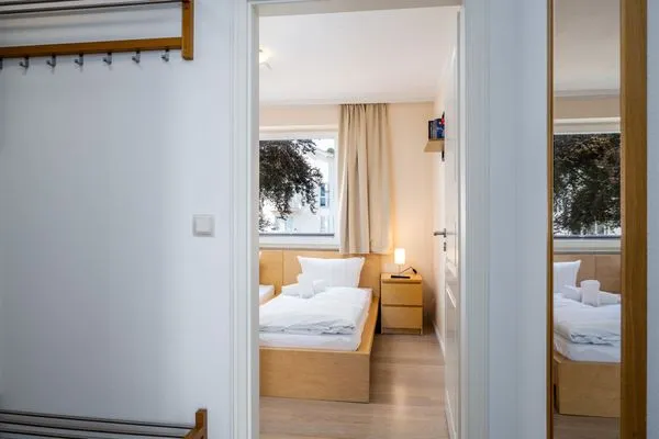 Schlafzimmer  FeWo Hafenliebe - Kamin, Sauna, Meerblick