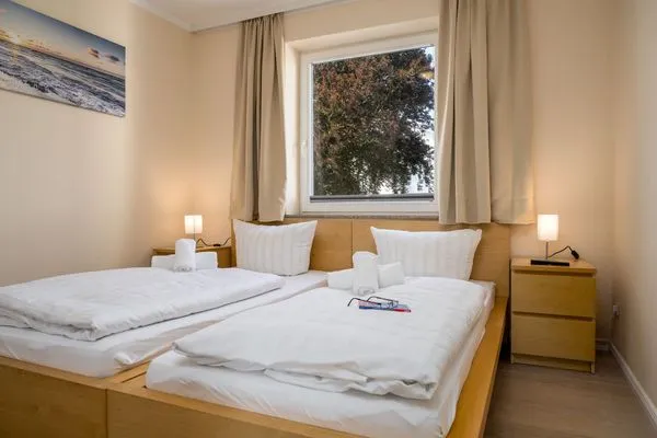 Schlafzimmer  FeWo Hafenliebe - Kamin, Sauna, Meerblick