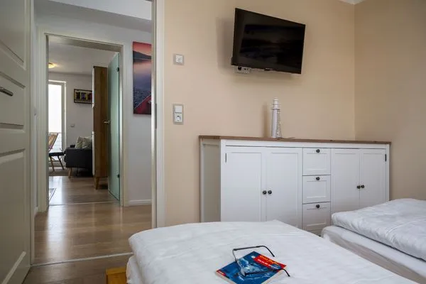 Schlafzimmer  FeWo Hafenliebe - Kamin, Sauna, Meerblick