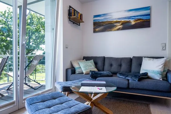 Wohnzimmer  FeWo Hafenliebe - Kamin, Sauna, Meerblick