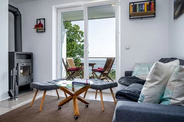 Wohnzimmer  FeWo Hafenliebe - Kamin, Sauna, Meerblick