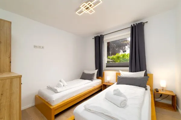 Schlafzimmer  FeWo Sonnenschein -  Kamin, Sauna, Meerblick