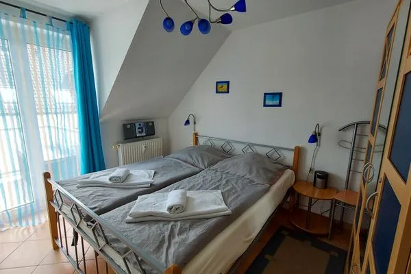 Schlafzimmer  Ferienwohnung Meeresleuchten