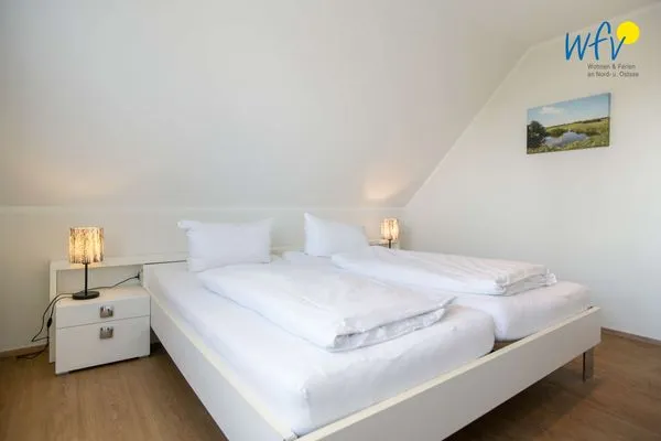 Schlafzimmer Apartmenthaus Roberta Ferienwohnung Meerblick