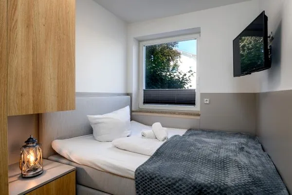 Schlafzimmer  FeWo Dwarslöper - Balkon, Sauna, Meerblick