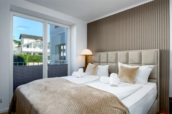 Schlafzimmer  FeWo Dwarslöper - Balkon, Sauna, Meerblick