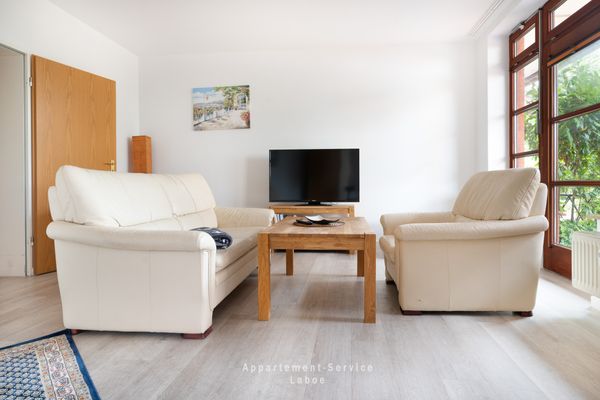  FeWo Sandkorn Laboe - Wohnzimmer