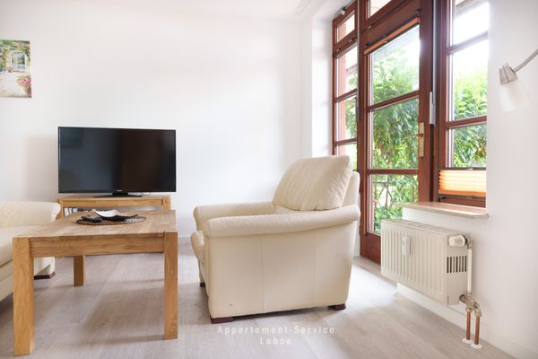  FeWo Sandkorn Laboe - Wohnzimmer