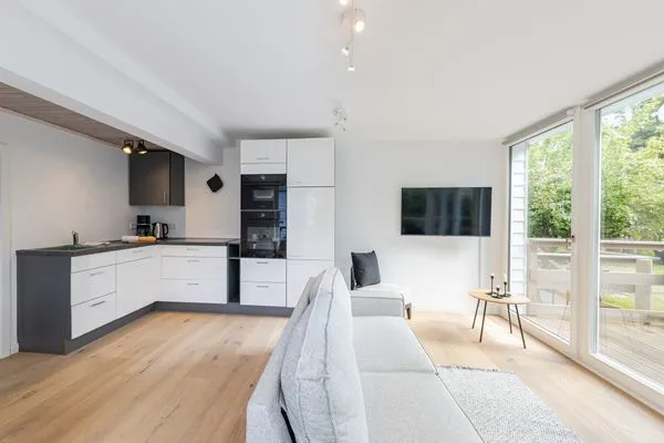 Wohnzimmer Haffperle Küstenglanz - zentral in Haffkrug, nur wenige Schritte zum Strand