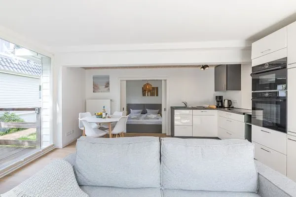 Wohnzimmer Haffperle Küstenglanz - zentral in Haffkrug, nur wenige Schritte zum Strand